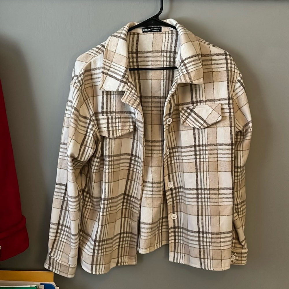 Size Large, warm shacket. Light tan, cream and brown colors with plaid design.